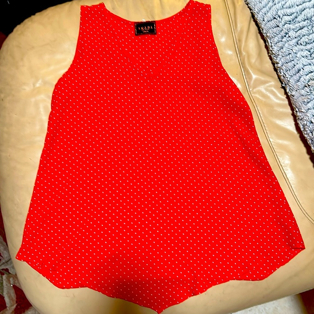 A red polka dotted tank top